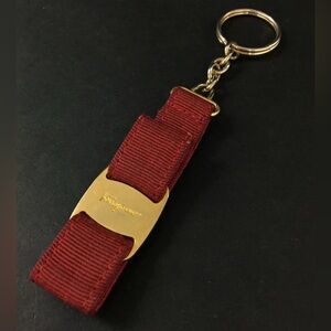 Ferragamo burgundy bag charm